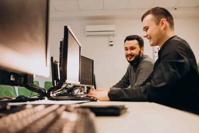 Young male web designers working on a computer